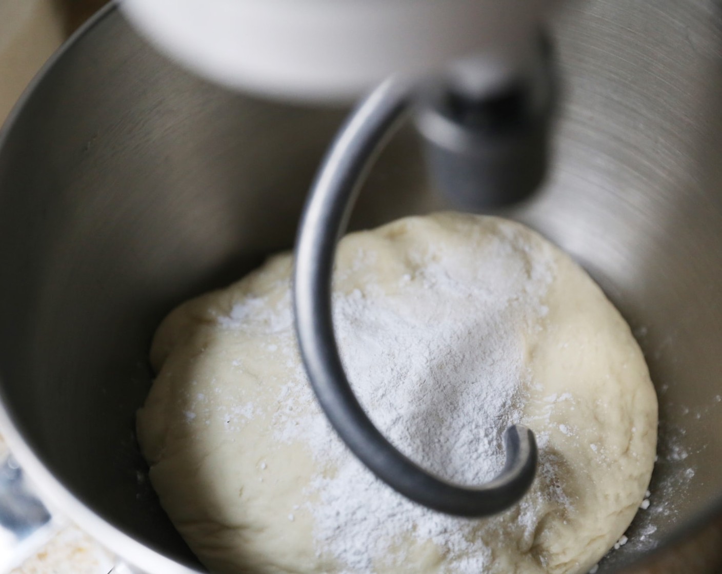 step 7 Place the dough back in the bowl of a stand mixer and add the Baking Powder (1 tsp) and knead into the dough for 5 minutes.