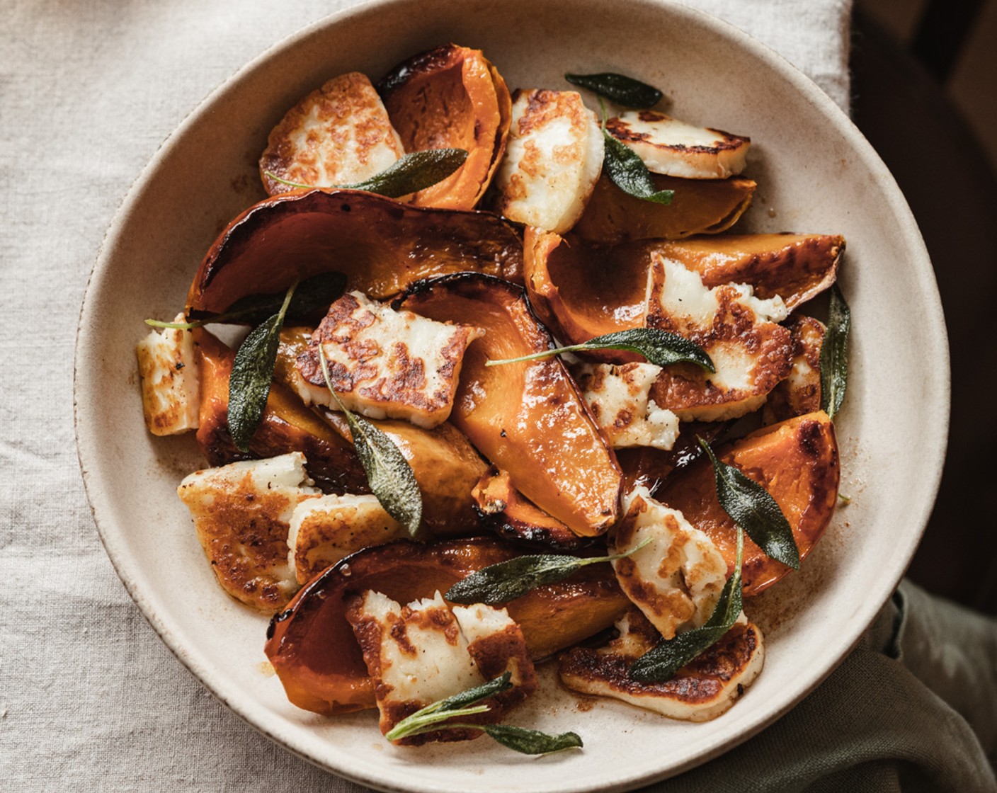 step 7 Cut your honey nut squash into smaller pieces. Plate the honeynut squash along with the fried halloumi, torn in half if desired. Finally, drizzle the browned butter all over the squash and halloumi and garnish with the crispy sage leaves. Enjoy!