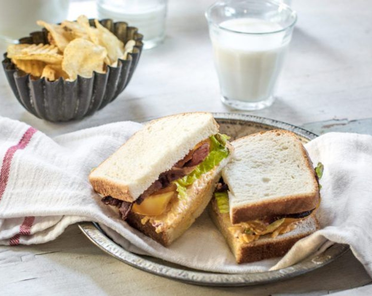 step 2 Add the Smoked Bacon (2 slices), Tomato (1), and Lettuce Leaves (to taste). Lastly, top with the final slice of Bread (1 slice). Serve and Enjoy!