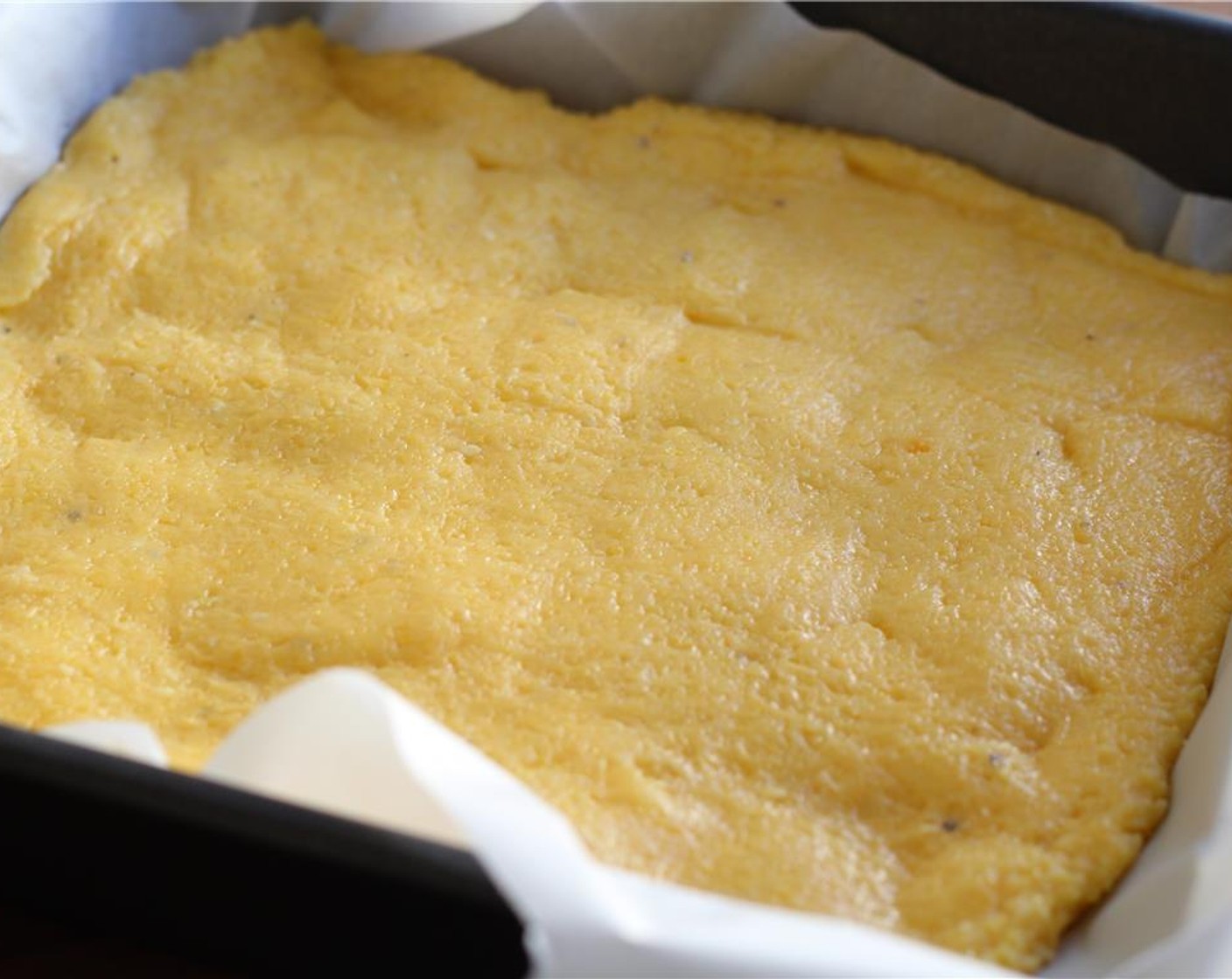 step 11 Spread the polenta into a large cookie sheet. Place in the fridge to cool for 45 minutes to 1 hour.