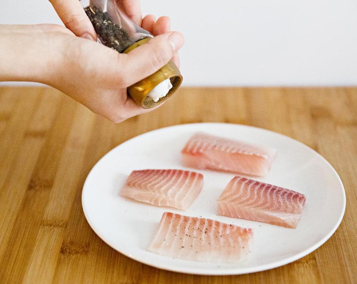 step 2 Add Salt (to taste) and Ground Black Pepper (to taste) to both sides of the snapper.