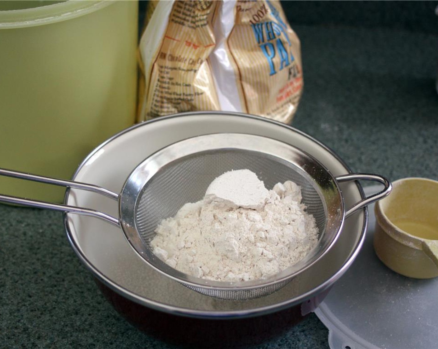 step 3 Sift the All-Purpose Flour (1/2 cup) and Whole Wheat Pastry Flour (1/2 cup) into a medium bowl using a mesh strainer or sifter.