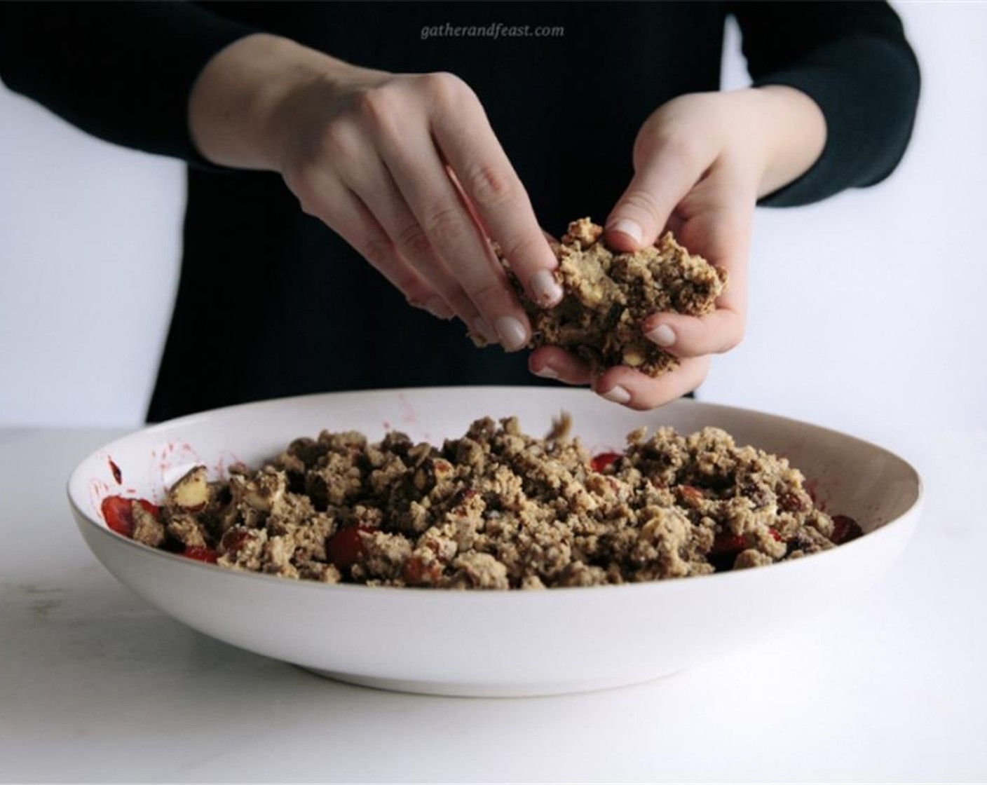 step 5 Add the chopped butter into the flour mixture and mix in with your fingertips to create a crumbly texture. Add the chopped hazelnuts to the mixture and stir to combine.