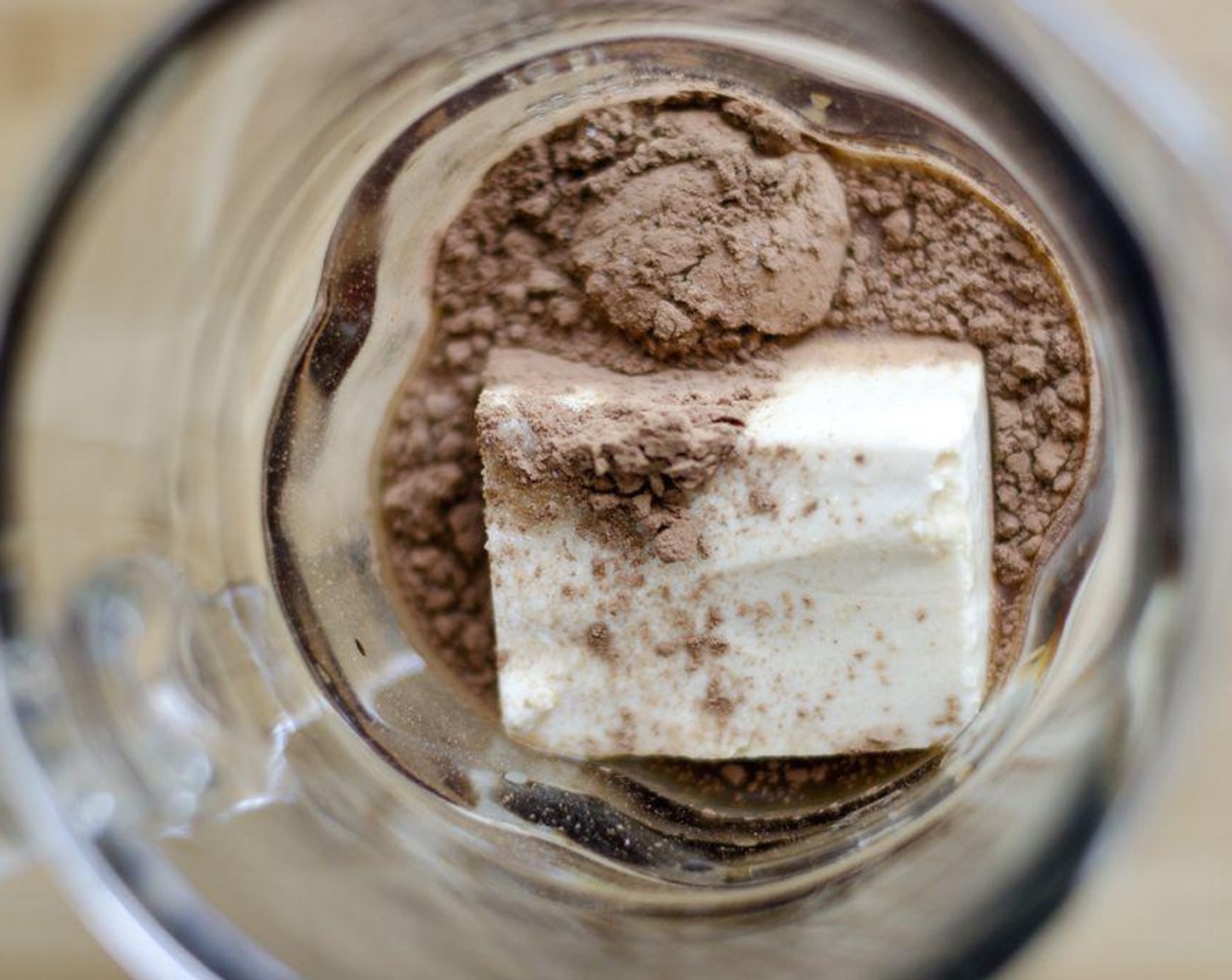 step 2 Combine coffee, Silken Tofu (1 cup), Dark Brown Sugar (1 Tbsp), Vanilla Extract (1/2 tsp), Unsweetened Cocoa Powder (2 Tbsp), and Ice (1 1/2 cups) in a blender until smooth, adding more ice to reach the consistency of your liking.