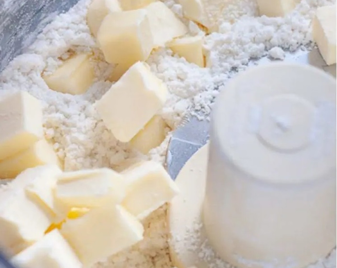 step 3 Throw in Unsalted Butter (1/2 cup), and pulse about 10 times, until butter is about the size of peas.