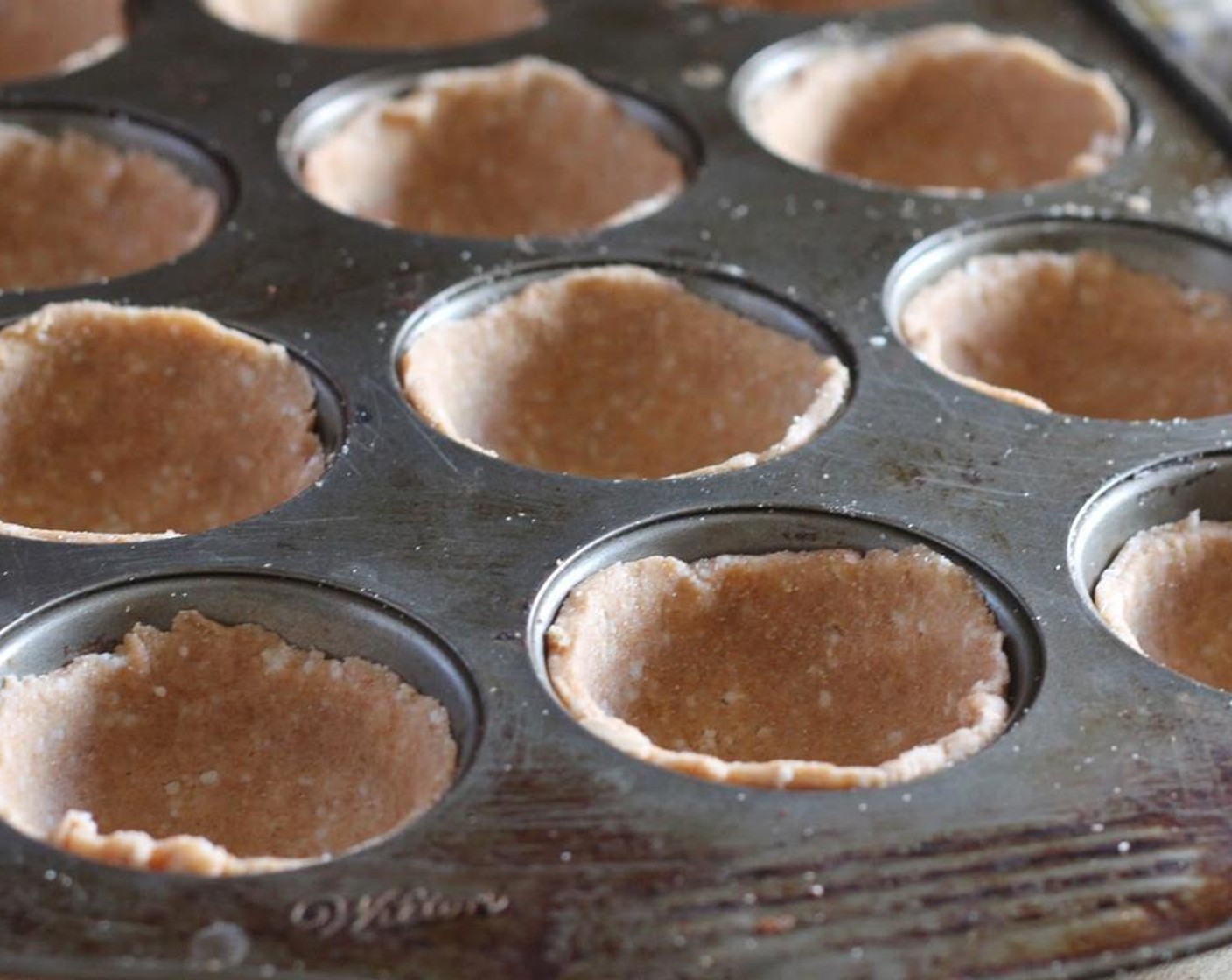step 6 Place circles into muffin tins, pressing them in to fit.