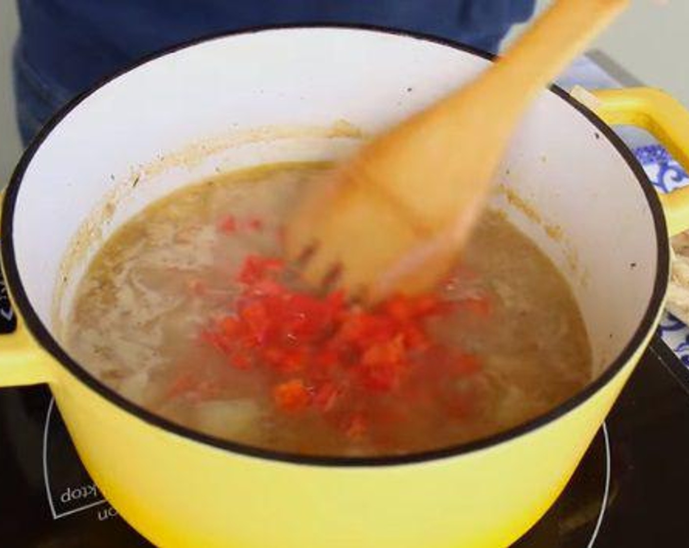 step 4 After 10 minutes, take out the chicken breast onto a plate. Add in the Red Bell Pepper (1/2) into the saucepan, and keep on cooking for about 10 more minutes.