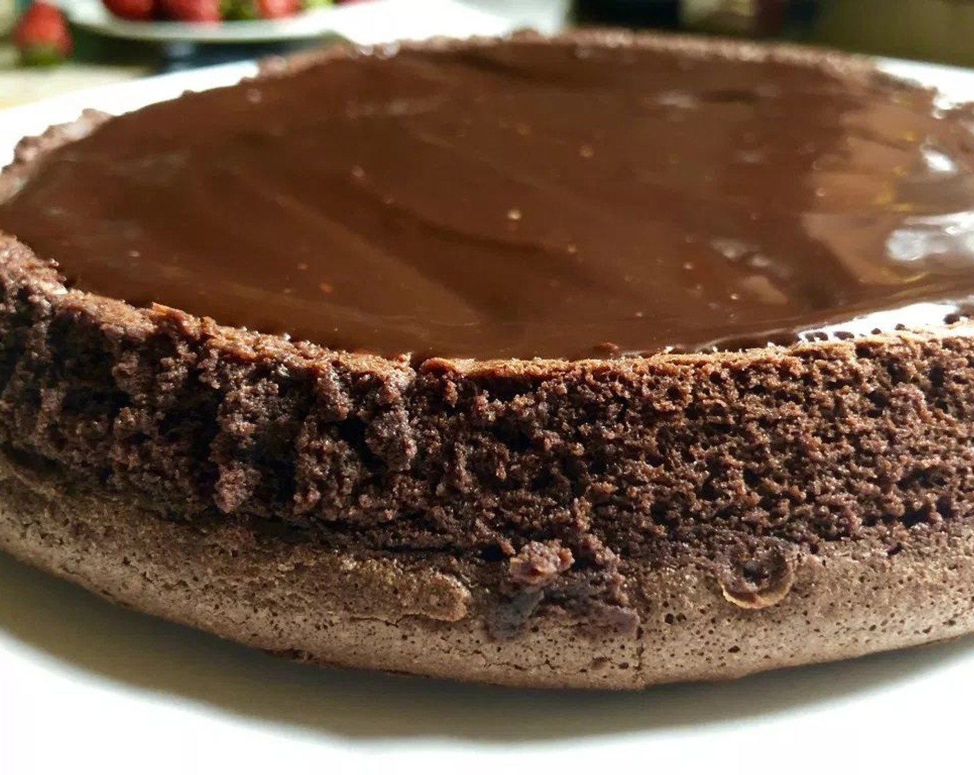 step 9 Spread the ganache evenly over the top of the cake. Let cool before slicing and serving. Best when served at room temperature.