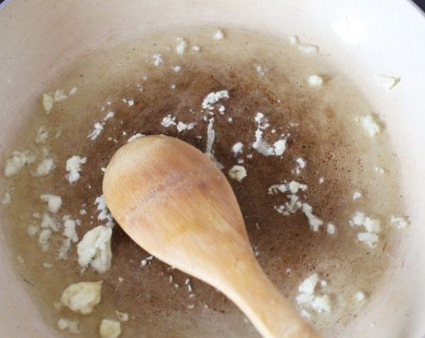 step 2 Heat a generous splash of Olive Oil (as needed) in a large, non-stick frying pan. Add the Garlic (2 cloves) and fry for 2-3 minutes, until it turns slightly golden in color.