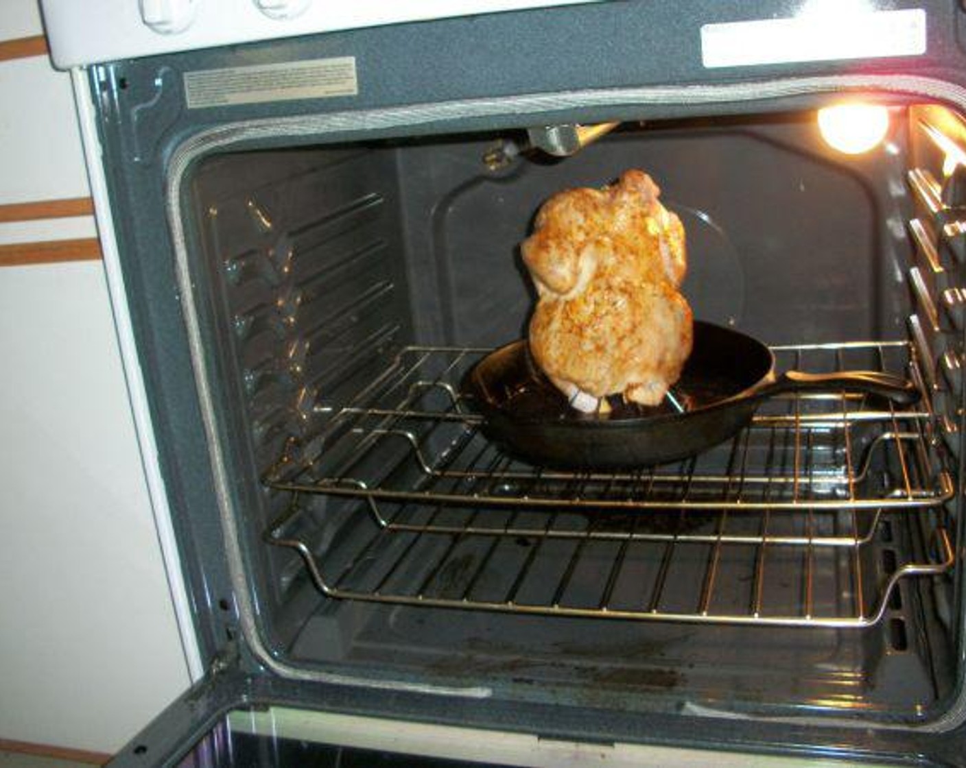 step 5 Place chicken in center of oven rack. Lower oven temperature to 425 degrees F (220 degrees C) and set timer for one hour.