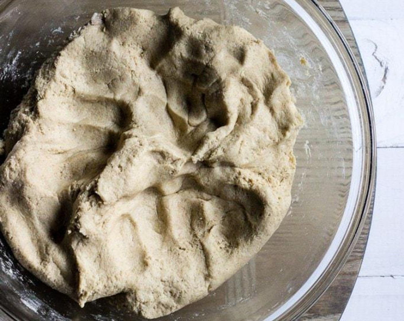 step 5 Knead the dough by hand in the bowl until contents are well combined. Remove dough from the bowl and knead on work surface until elastic for 3 to 5 minutes.