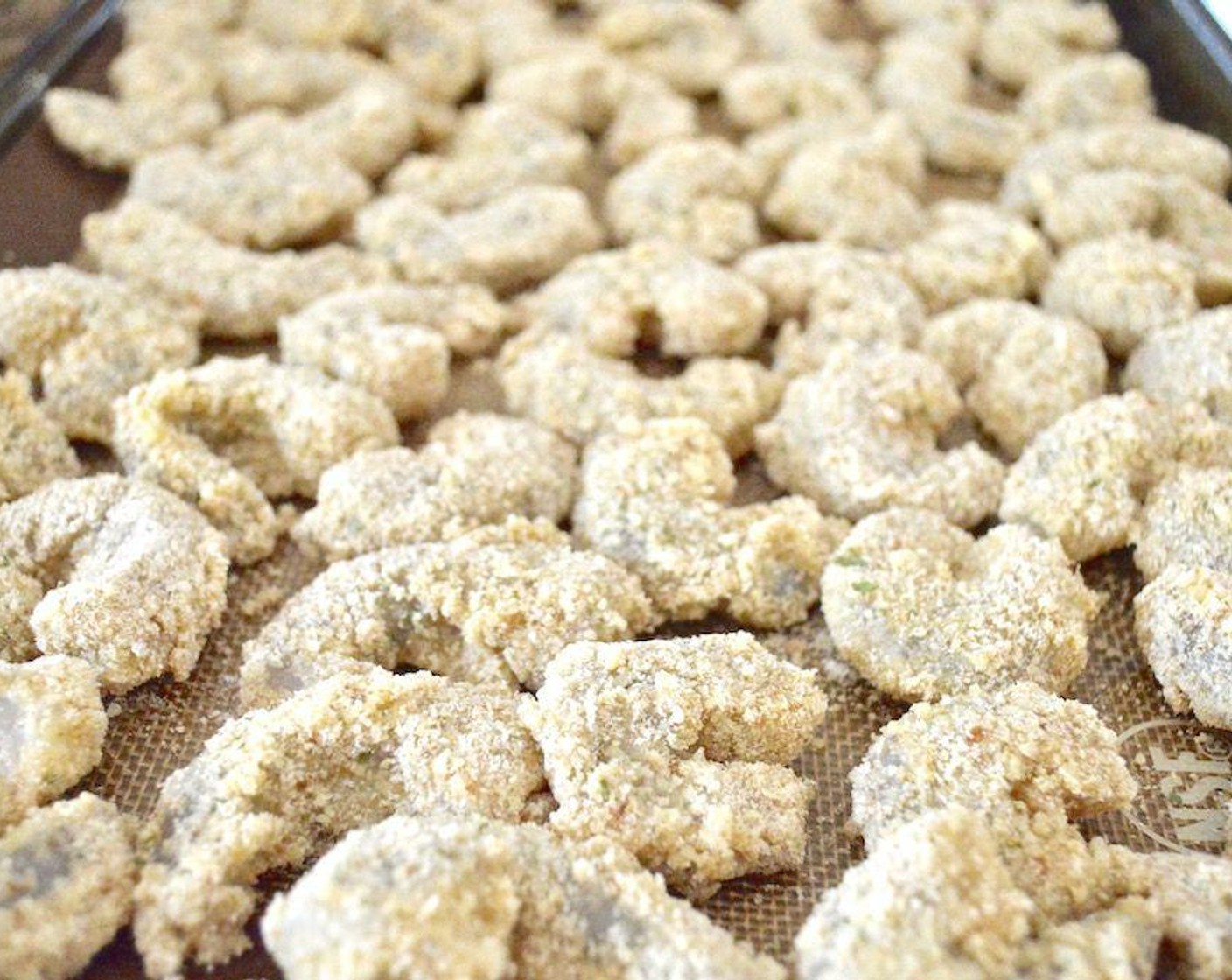 step 5 Continue until all of the shrimp are breaded and laid out. Refrigerate the tray of them to set the coating for 30 minutes.