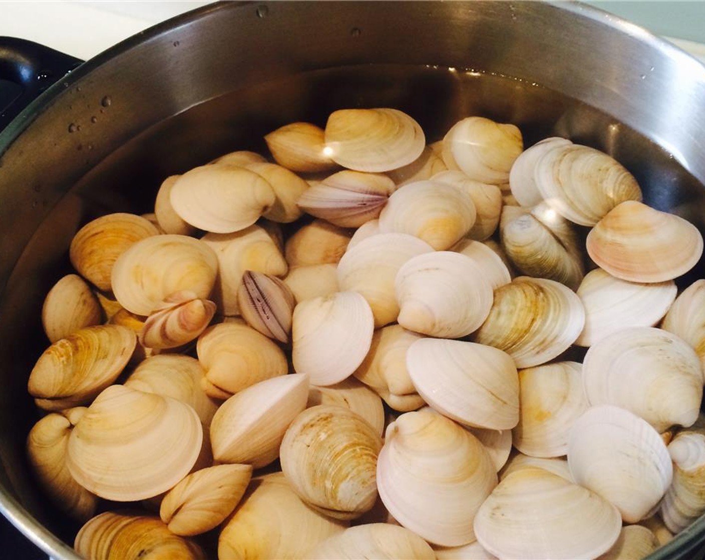 step 1 In a pot, add the Fresh Clams (3 lb) and Water (5 cups). Bring to a boil and cook the clams until they open. Remove the scum off the top. Drain the liquid and set aside.