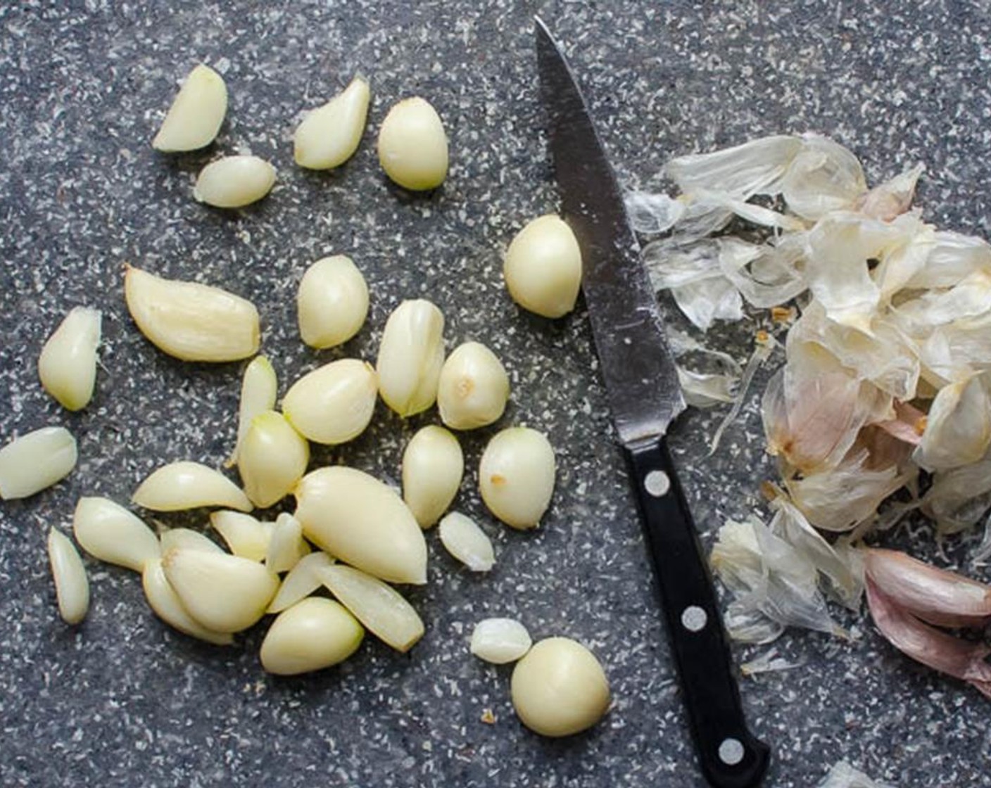 step 2 Bring a small saucepan of water to boil. Break apart the Garlic (2 cloves) and add them to the boiling water and cook for 1-2 minutes. Drain the garlic and peel the cloves, discarding the skins.
