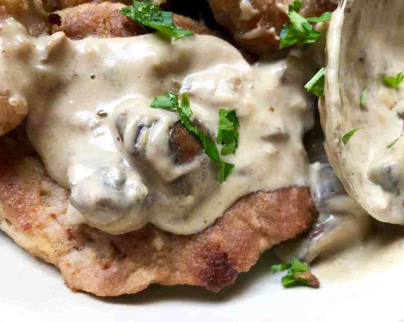 step 12 Place pork on plates and top with the sauce. Garnish with Fresh Parsley (1/4 cup).