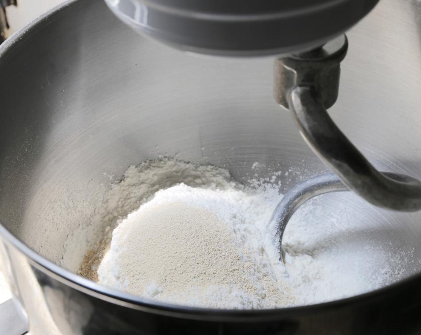 step 1 Combine the Instant Dry Yeast (1 tsp) and All-Purpose Flour (2 3/4 cups) in the bowl of a stand mixer with the dough hook attached. Mix on a low speed for about 2 minutes, until the yeast is evenly distributed.