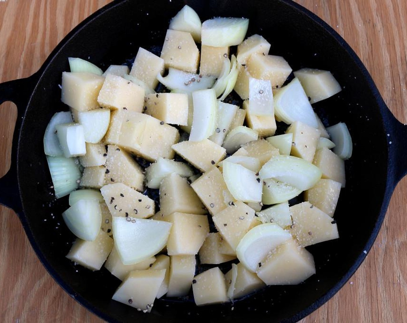 step 2 Coat the onions and potatoes in Duck Fat (2 Tbsp), and season with Freshly Ground Black Pepper (to taste) and Kosher Salt (to taste).