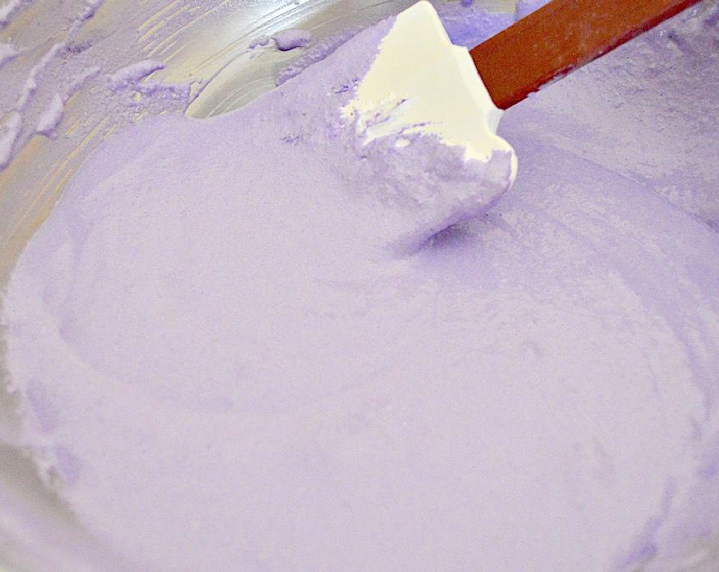 step 2 Whisk them together in the bowl to blend them. Then pour in Eggs (2 1/2) White liquid, the Ground Lavender (1/2 tsp), and Purple Food Coloring (1/2 tsp). Use a spatula to fold and mash the mixture together into a uniform paste. Set the paste aside.