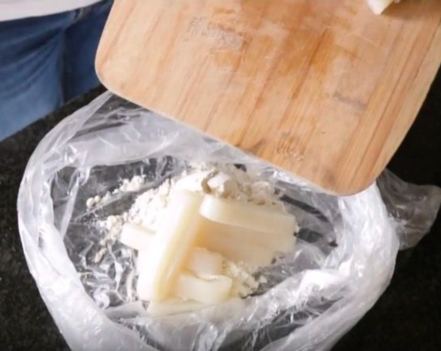 step 8 Add All-Purpose Flour (1/2 cup) and Sea Salt (1/4 tsp) into a plastic bag, then add the Squid Rings into the bag and mix together until the rings are all well coated. Set aside.