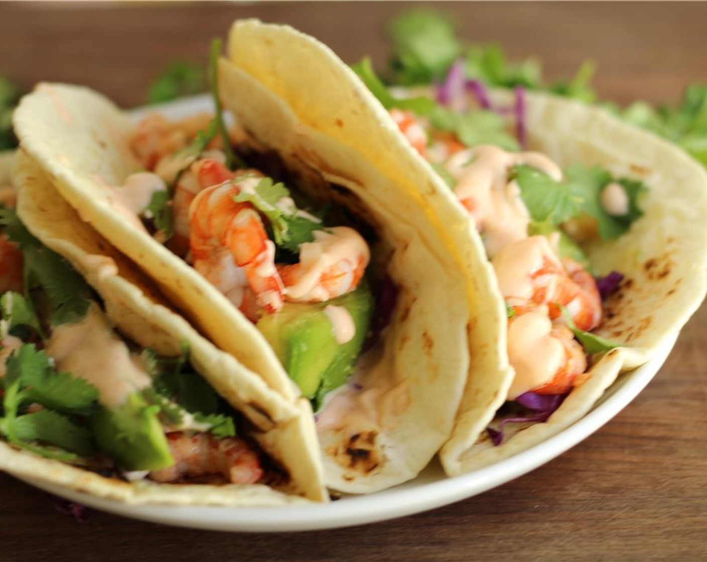 step 11 Assemble your taco by adding some shrimp, red cabbage, avocado and sauce. Enjoy!