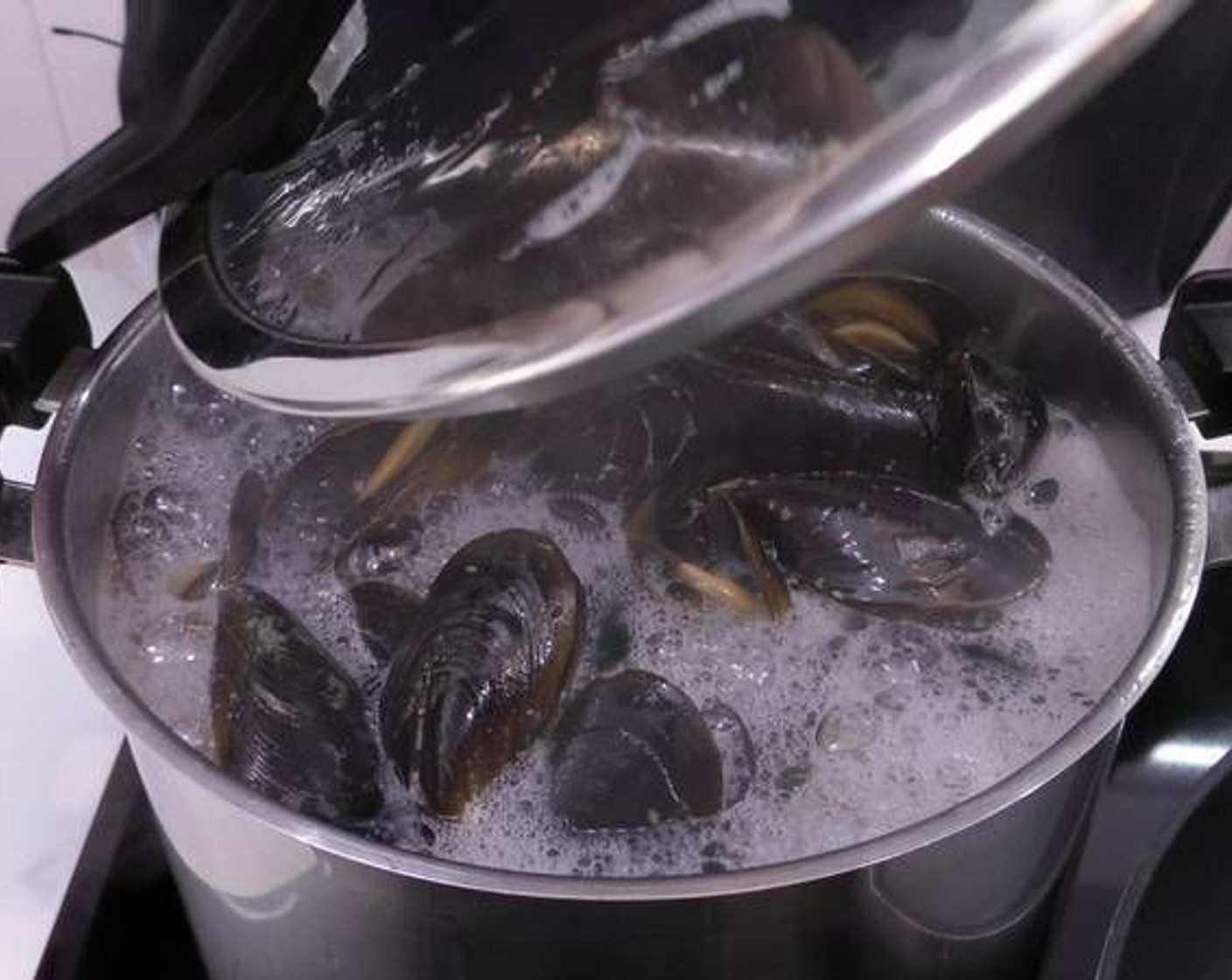 step 2 Cook for 10 minutes on medium heat. Make sure all the mussels open up, if there are any that do not open discard them.