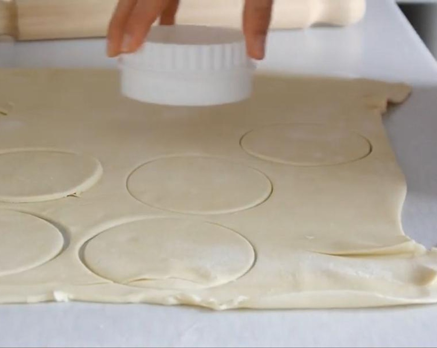 step 1 Extend the Frozen Shortcrust Pastry (1.1 lb) using a rolling pin until is about 3mm thick. Using a round cookies cutter cut round shapes using all the dough