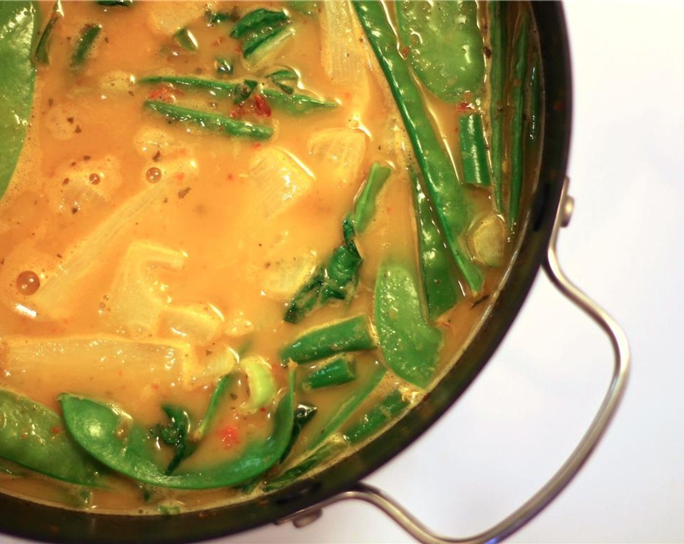 step 7 Once the vegetables are softened, add the Coconut Milk (27 fl oz), Bamboo Shoots (1/2 cup), juice from Lime (1/2) and Vegetable Stock (3 cups).