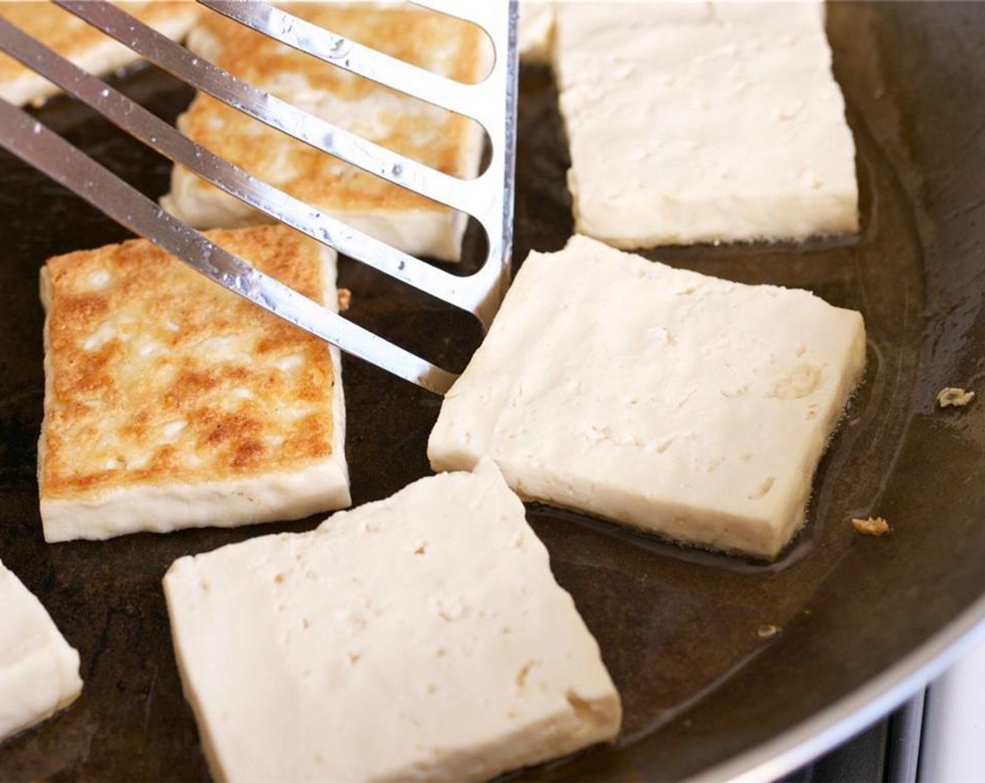 step 10 Flip to the other side, add 1 more tbsp of oil if your pan seems dry. Continue to sear the tofu for another 5 minutes or until they are done to your liking. For softer tofu, reduce the cooking time.
