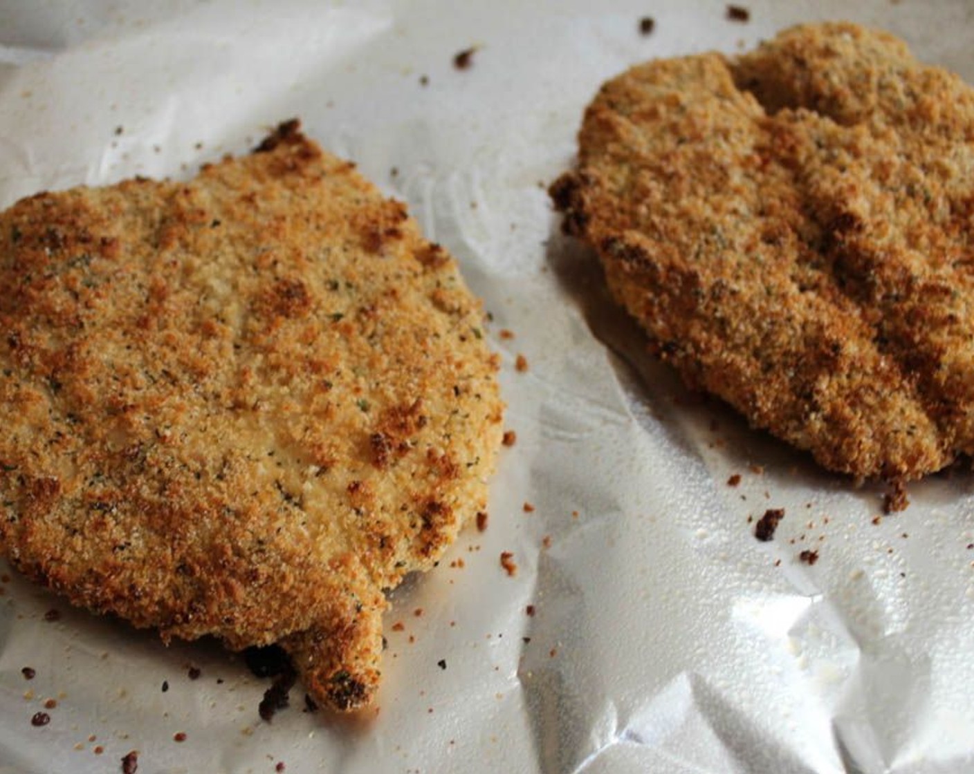 step 7 Place the breaded cutlets on the prepared baking sheet and bake for 25 minutes until they are golden brown and the chicken is cooked through. If they are not browned enough, just pop them under the boiler for 90 seconds or so, and they'll get nice and crispy.