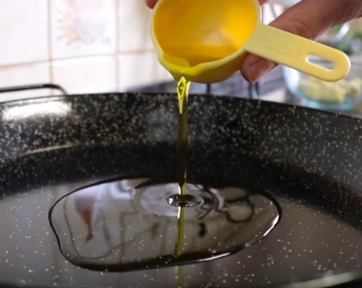 step 7 Place a paella pan over medium-high heat and add Extra Virgin Spanish Olive Oil (4 Tbsp). Allow to warm up for 1 minute.