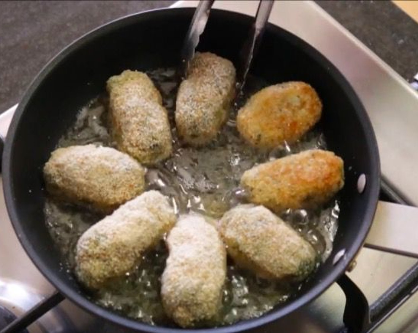 step 12 Heat a small frying pan over a medium-high heat and add Sunflower Oil (1/3 cup). Once the oil gets hot, add the croquettes into the pan and fry for 60-75 seconds on each side. Transfer to a dish with paper towels as finished.