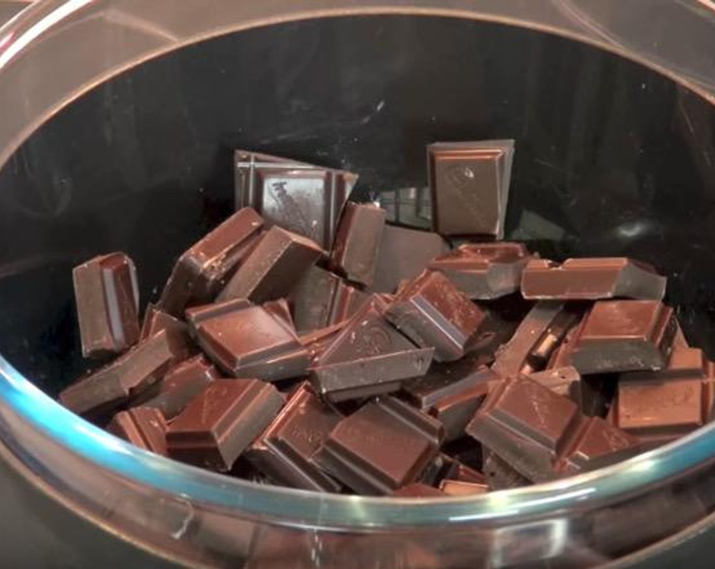 step 1 In a heat-proof bowl suspended over a saucepan of simmering water, add Dark Chocolate (1 3/4 cups). Cook, stirring occasionally, until the chocolate is melted and smooth.