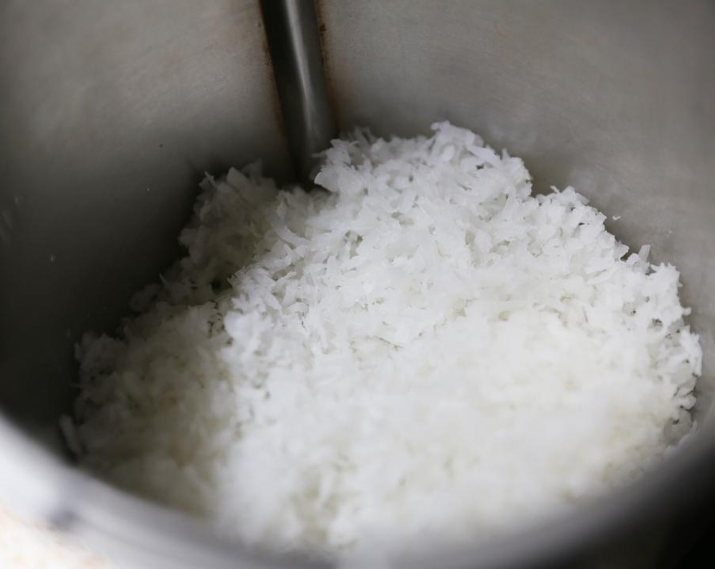 step 1 Add the Sweetened Shredded Coconut (4 cups) to the jug or bowl of your food processor and blend on high for about 5 minutes.