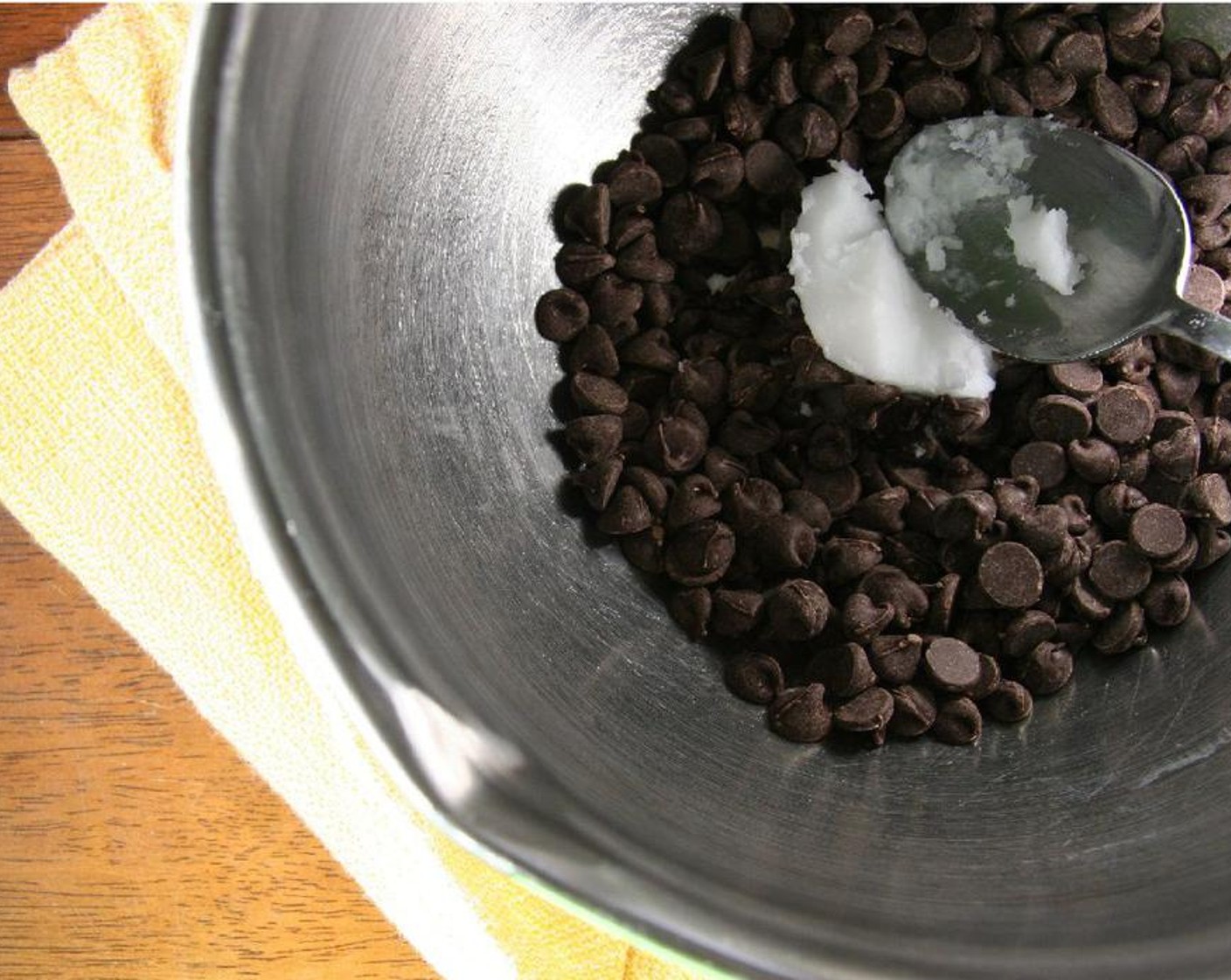 step 1 Melt Chocolate Chips (1 cup) and Coconut Oil (1 Tbsp) over a double boiler or in the microwave, stirring after every minute until smooth.