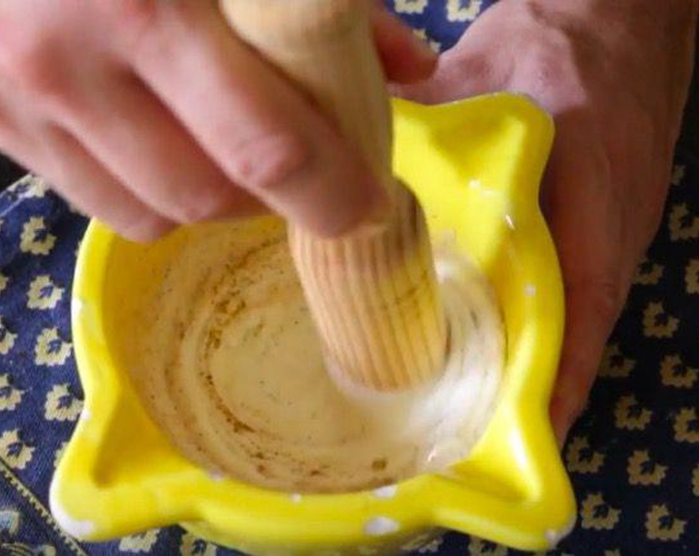 step 2 Using a pestle, pound down on the garlic until you form a paste, then add Greek Yogurt (1/2 cup) and season generously with Sea Salt (to taste), Ground Black Pepper (to taste), the juice from Lemon (1) and mix everything together.