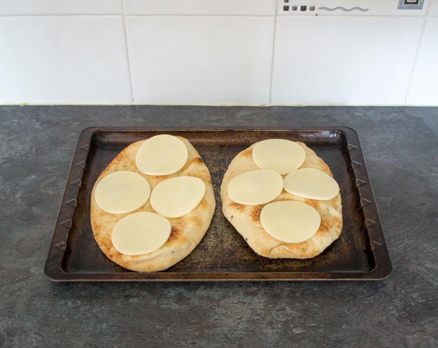 step 3 Next, evenly lay the Mozzarella Cheese (1 1/3 cups) over each one.
