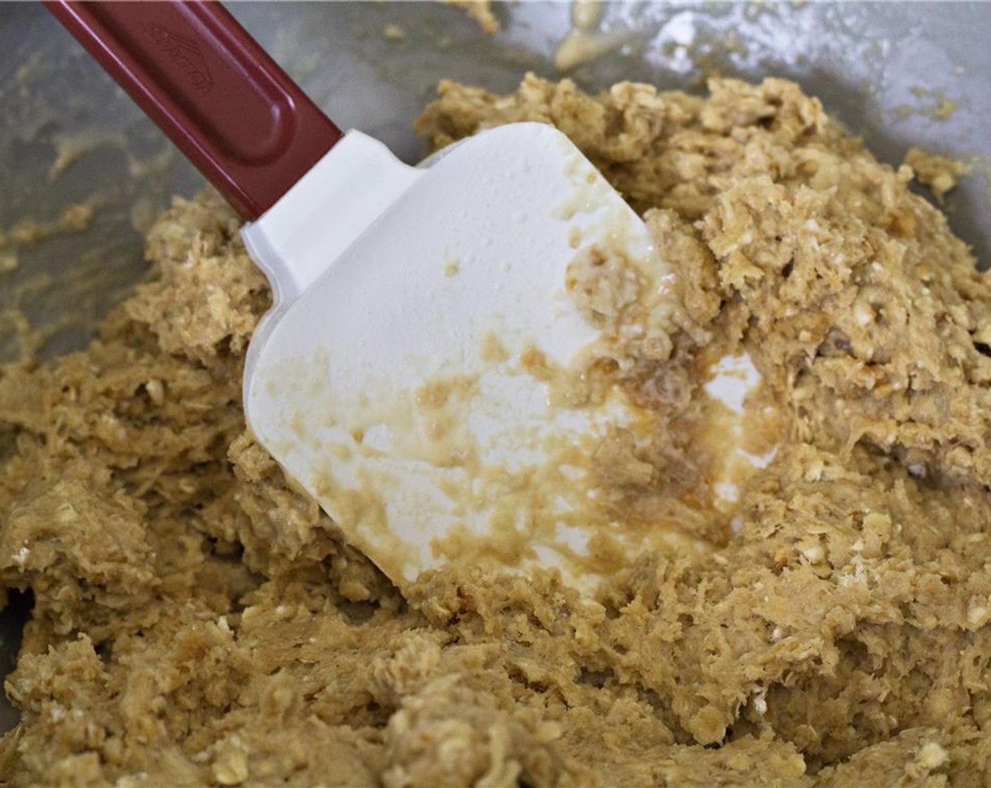 step 6 Add egg mixture and No-Stir Natural Peanut Butter (1/2 cup) to the bowl of dry ingredients. Use a spatula to incorporate until just combined.