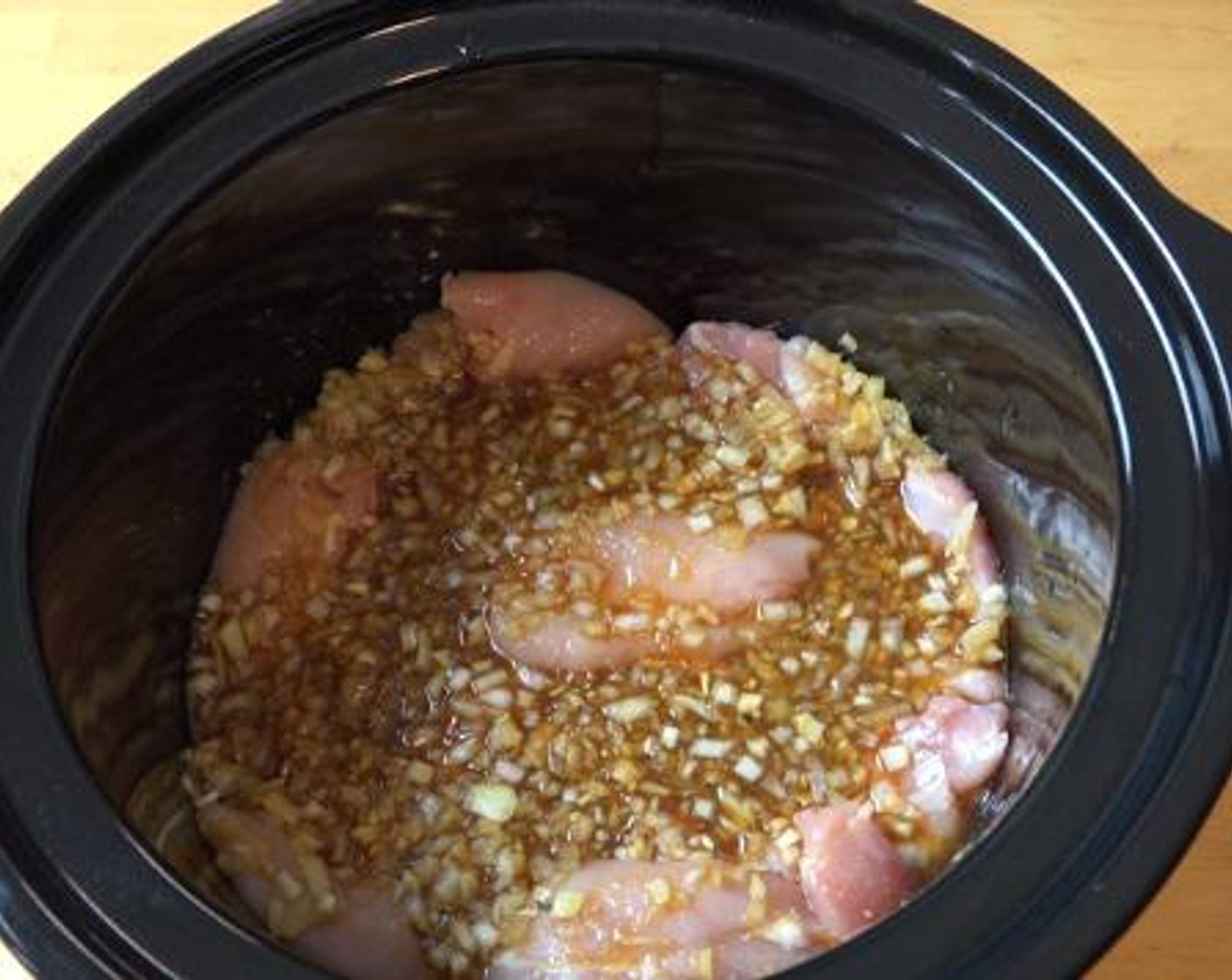 step 2 Cut the Boneless, Skinless Chicken Thighs (2.2 lb) into pieces and place them on the bottom of a slow cooker. Pour the marinade over the chicken, turn on the slow cooker to high and cook the entire mixture for about 4 hours.