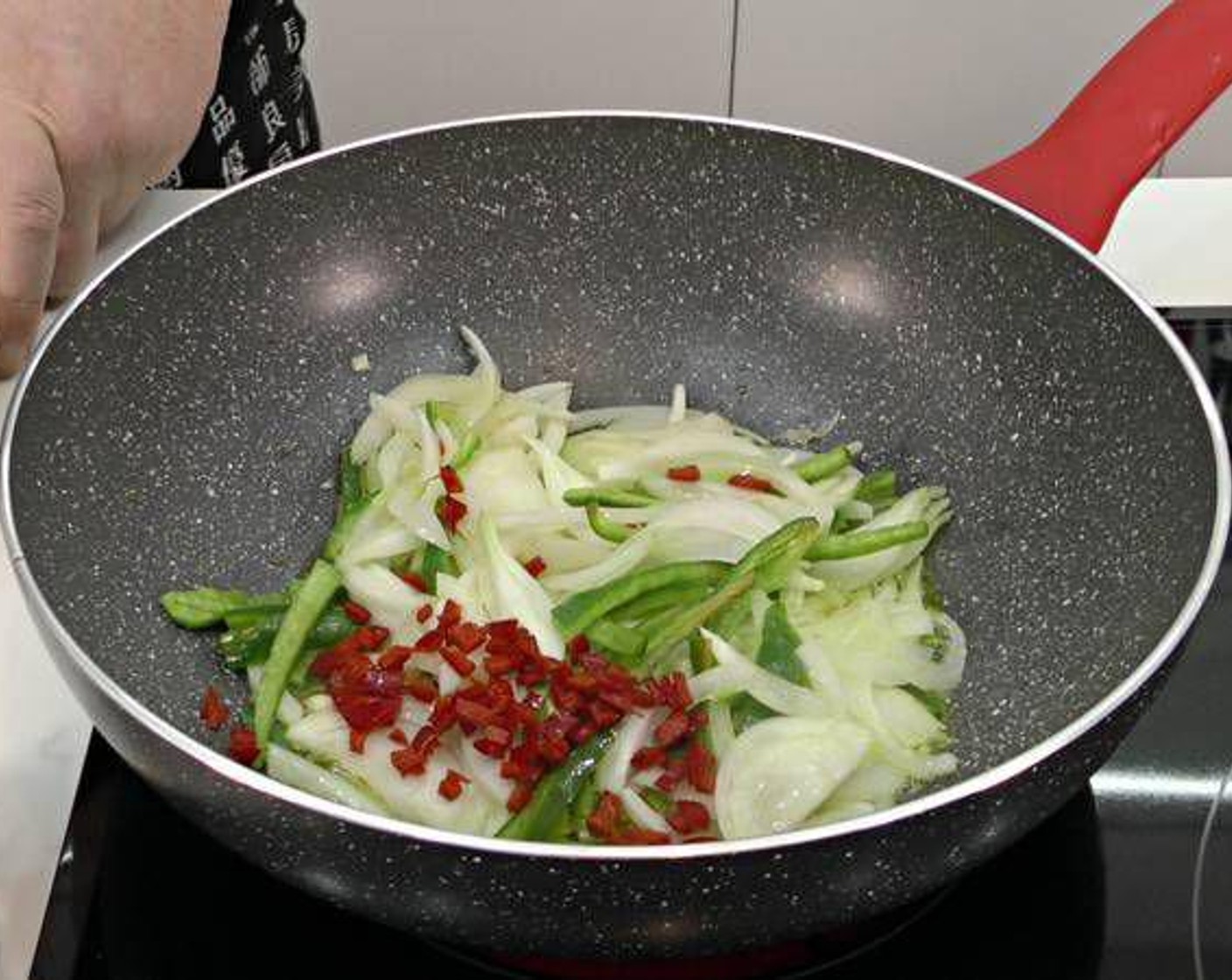 step 5 Add the onion and garlic to a pan with Olive Oil (as needed) on medium heat. Season with Salt (to taste). Add in the green bell pepper and chili pepper.