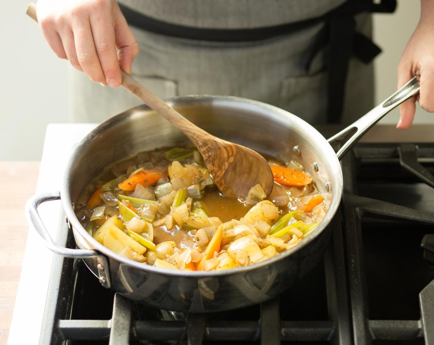 step 9 Add rosemary, potatoes, carrots and celery; cook for 2 minutes. Stir in beef broth and Demi-Glace (1 oz) and bring to a boil.