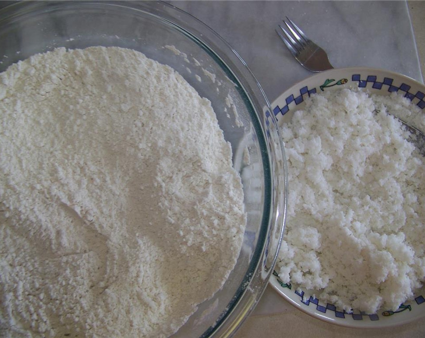 step 1 Sift the All-Purpose Flour (3 cups). Add Salt (to taste), Coconut (1 cup) and Canola Oil (1 Tbsp) to the bowl and mix well.