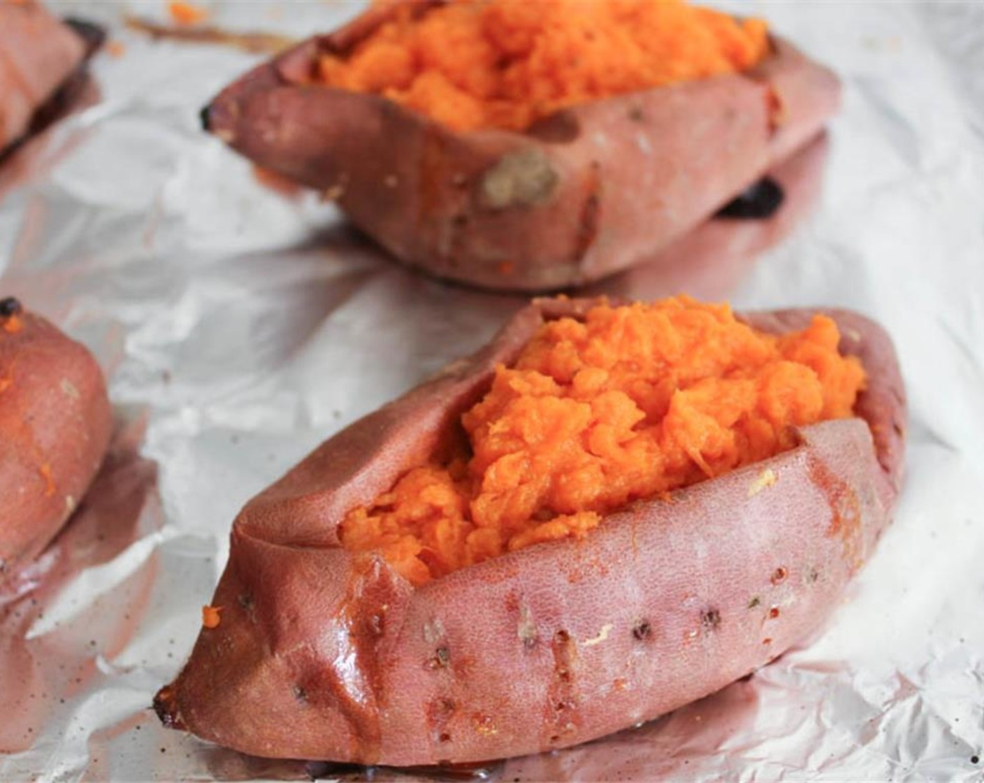 step 9 Carefully spoon the mashed sweet potatoes back into their skins.