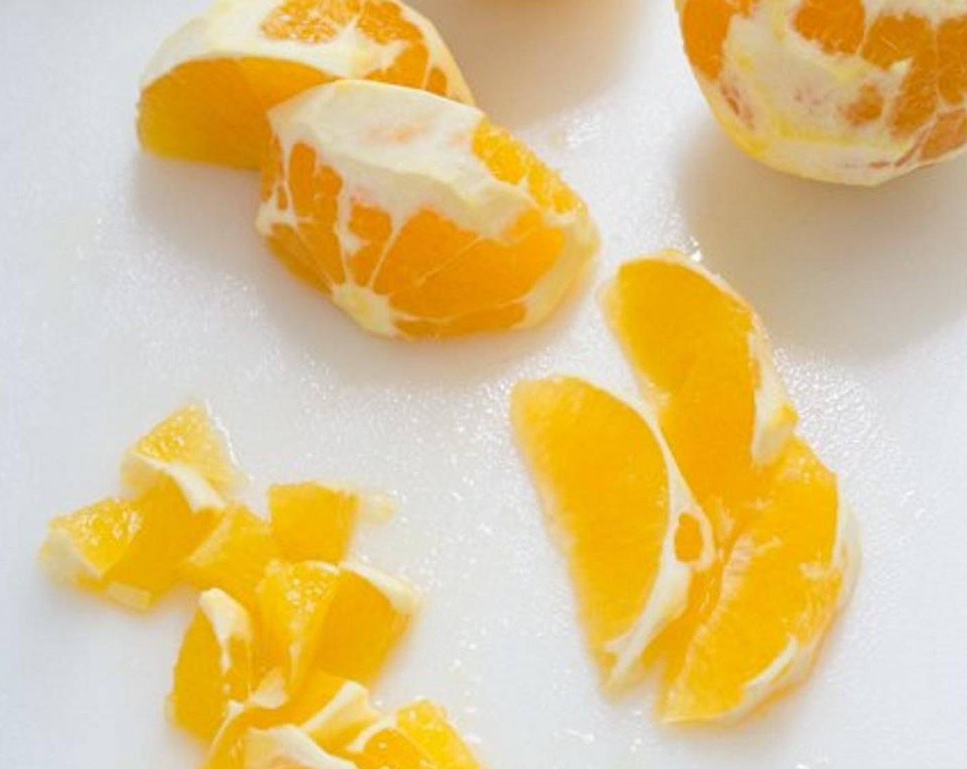 step 3 Remove and discard the peel and the most of the white membrane from the rest of the oranges.