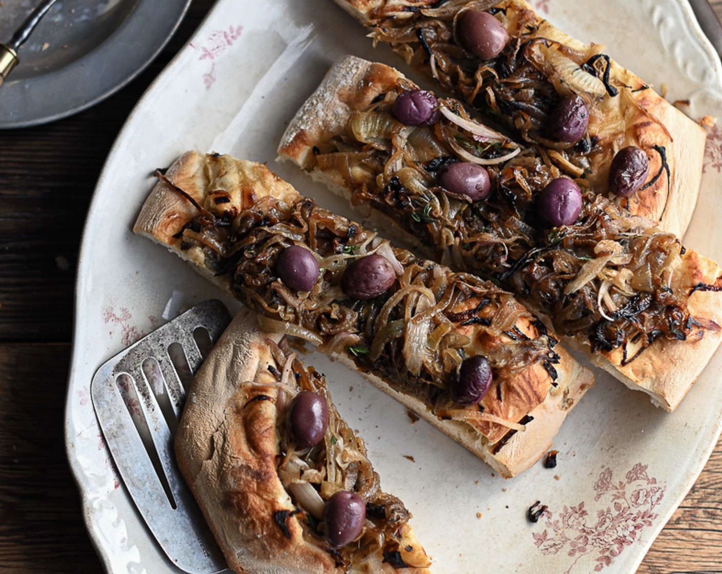 step 10 Finish off with a generous sprinkle of Grated Parmesan Cheese (to taste). Slice and serve the focaccia with a green salad or alongside a more robust meal like a roast chicken.