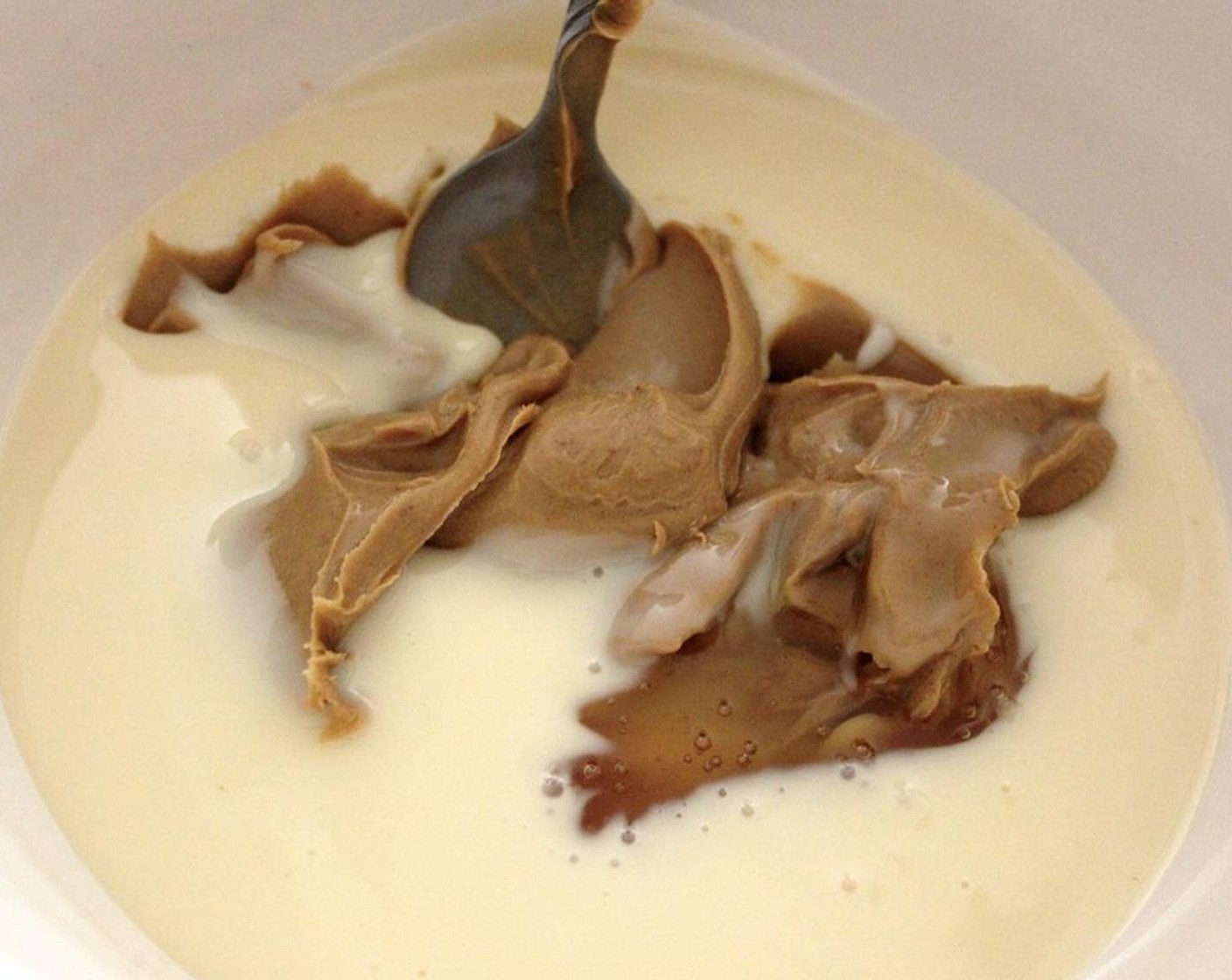 step 3 In a medium bowl, mix the Sweetened Condensed Milk (1 can), Creamy Peanut Butter (1/2 cup), and Honey (1/2 cup) and set aside.