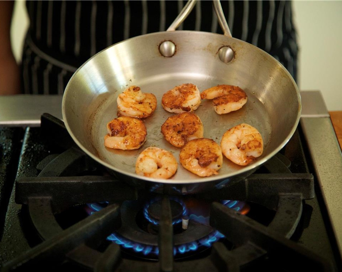 step 11 Cook shrimp in a single layer for 2 minutes. Flip shrimp and continue to cook for 1 minute. Remove from pan.