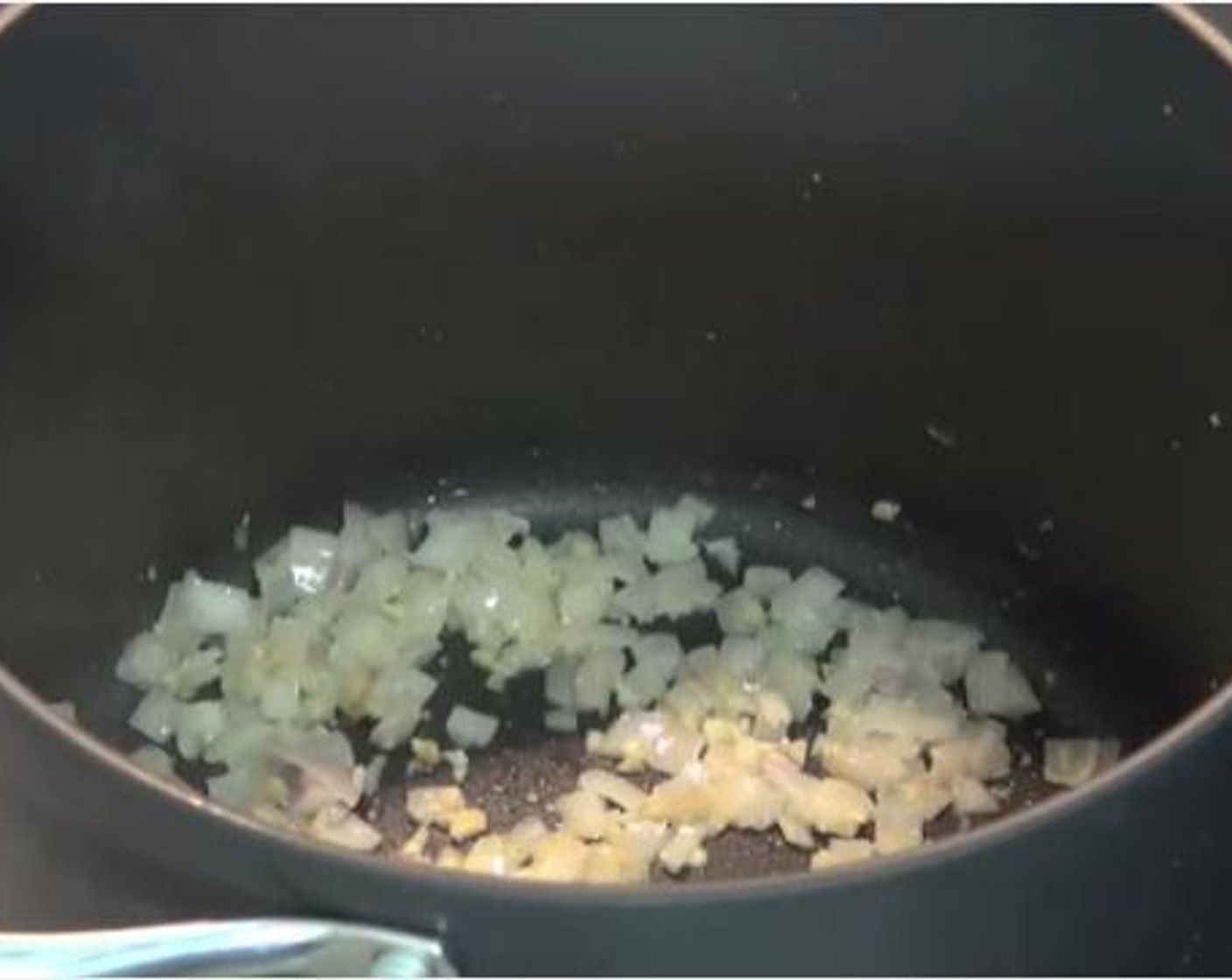 step 1 Into a large pot, add the Olive Oil (as needed). Over medium heat, add the Yellow Onion (1) and Garlic (2 cloves). Cook for 3 minutes until the onions are nice and soft.