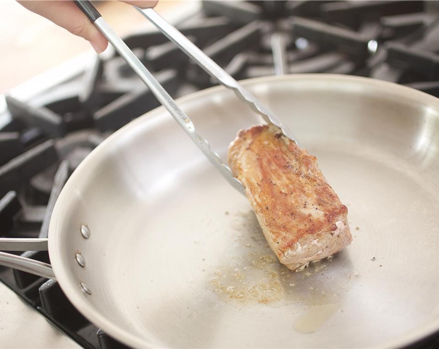 step 6 Pat the Pork Tenderloin (8 oz) dry with paper towels. Season with Salt (1/4 tsp) and Ground Black Pepper (1/4 tsp). In a large saute pan over medium high heat, add Olive Oil (1 Tbsp) and sear pork on all sides until deeply caramelized, two minutes on each side.