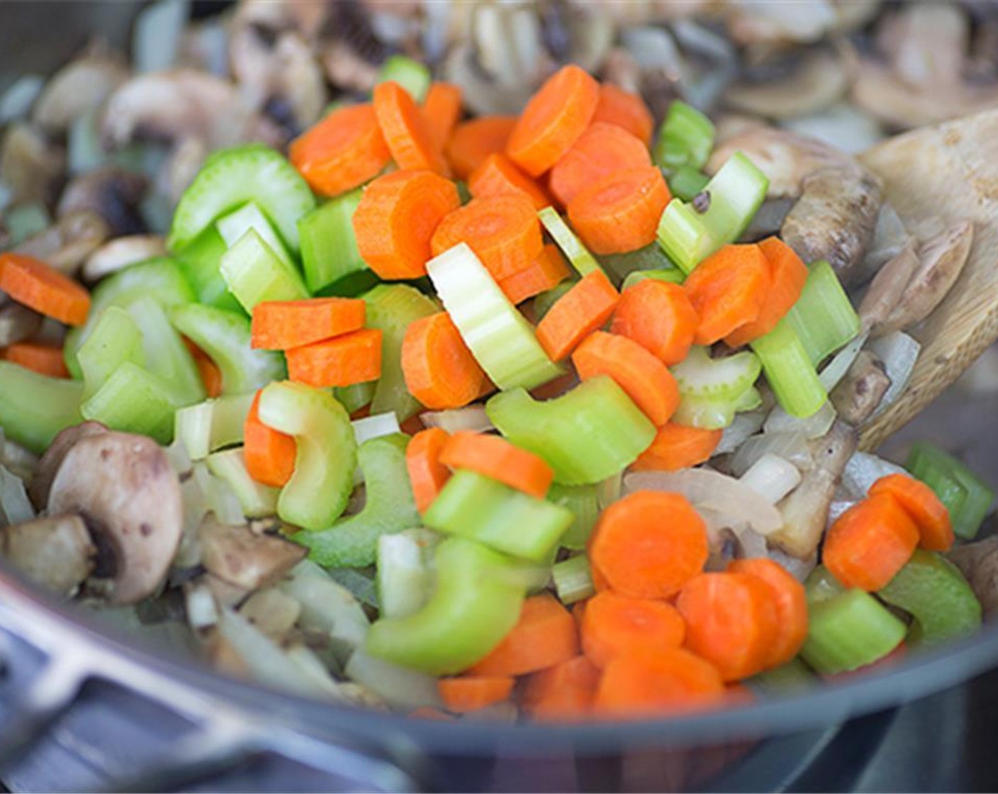 step 7 Add finely diced Carrots (2) and finely diced Celery (2 stalks) and cook until soft.