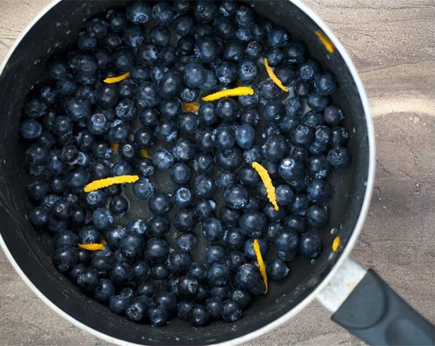 step 1 To make the blueberry pie filling start by adding Fresh Blueberries (1 1/2 cups), Granulated Sugar (1/2 Tbsp), Orange (1 tsp), Water (1 Tbsp) and Corn Starch (1 Tbsp). Cook on low heat for 15 minutes.
